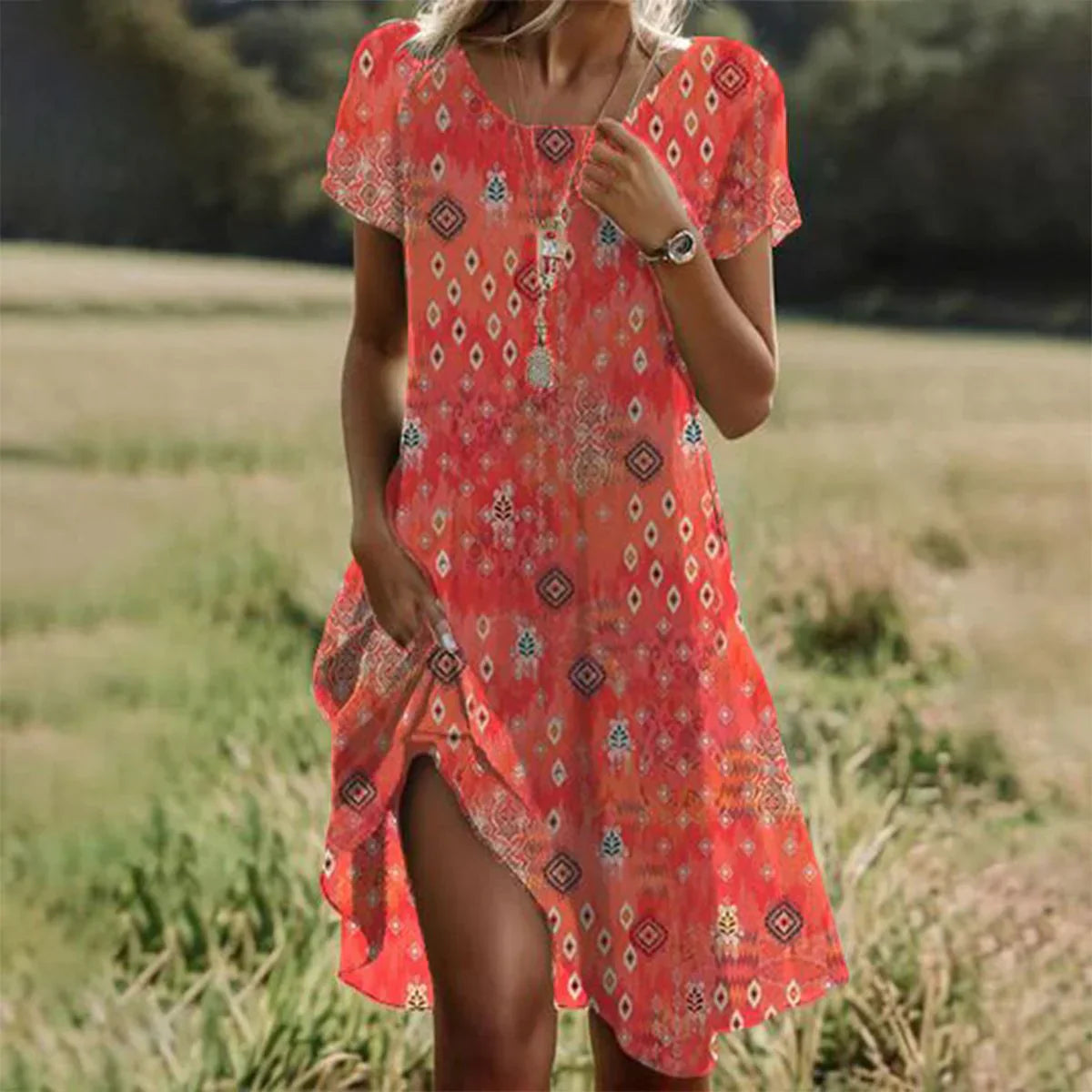 Sophia – orange midi dress with short sleeves and a round neckline